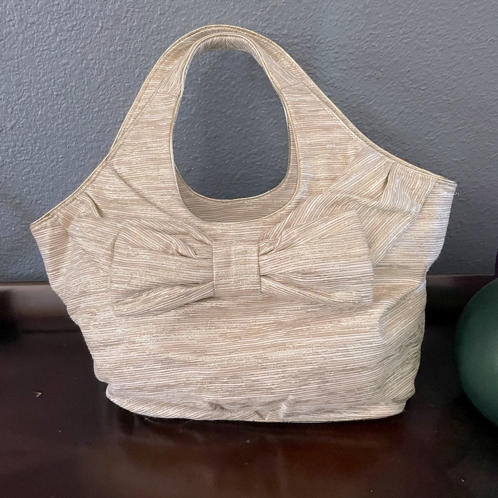 Soft tweed shoulder bag in creamy neutrals by Kate Spade. Gently used